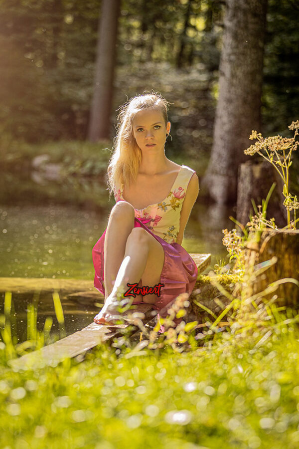 Bavarian Beauty Emi in a sexy dirndl in the forest